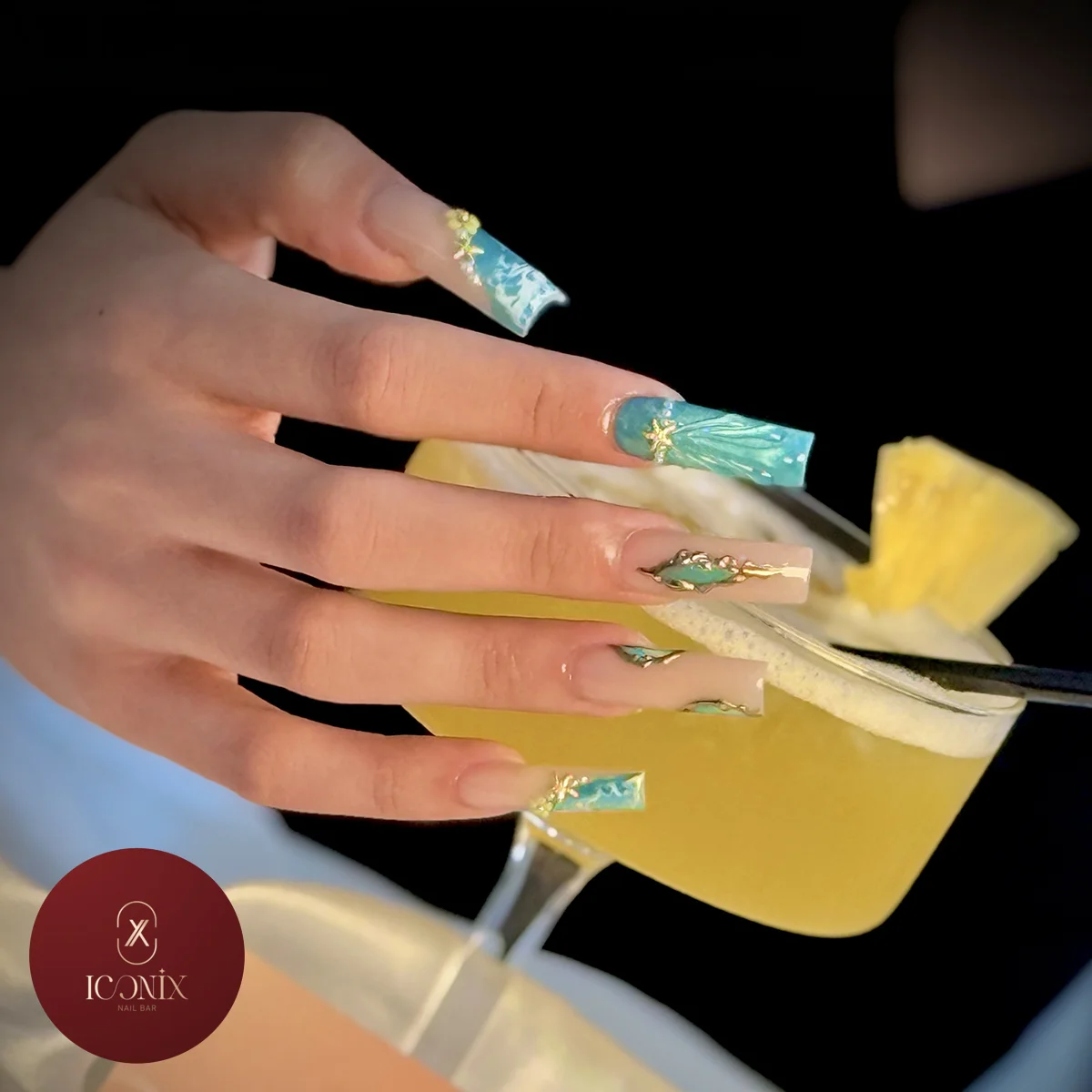 Elegant manicure with glossy nail art at Iconix Nail Bar